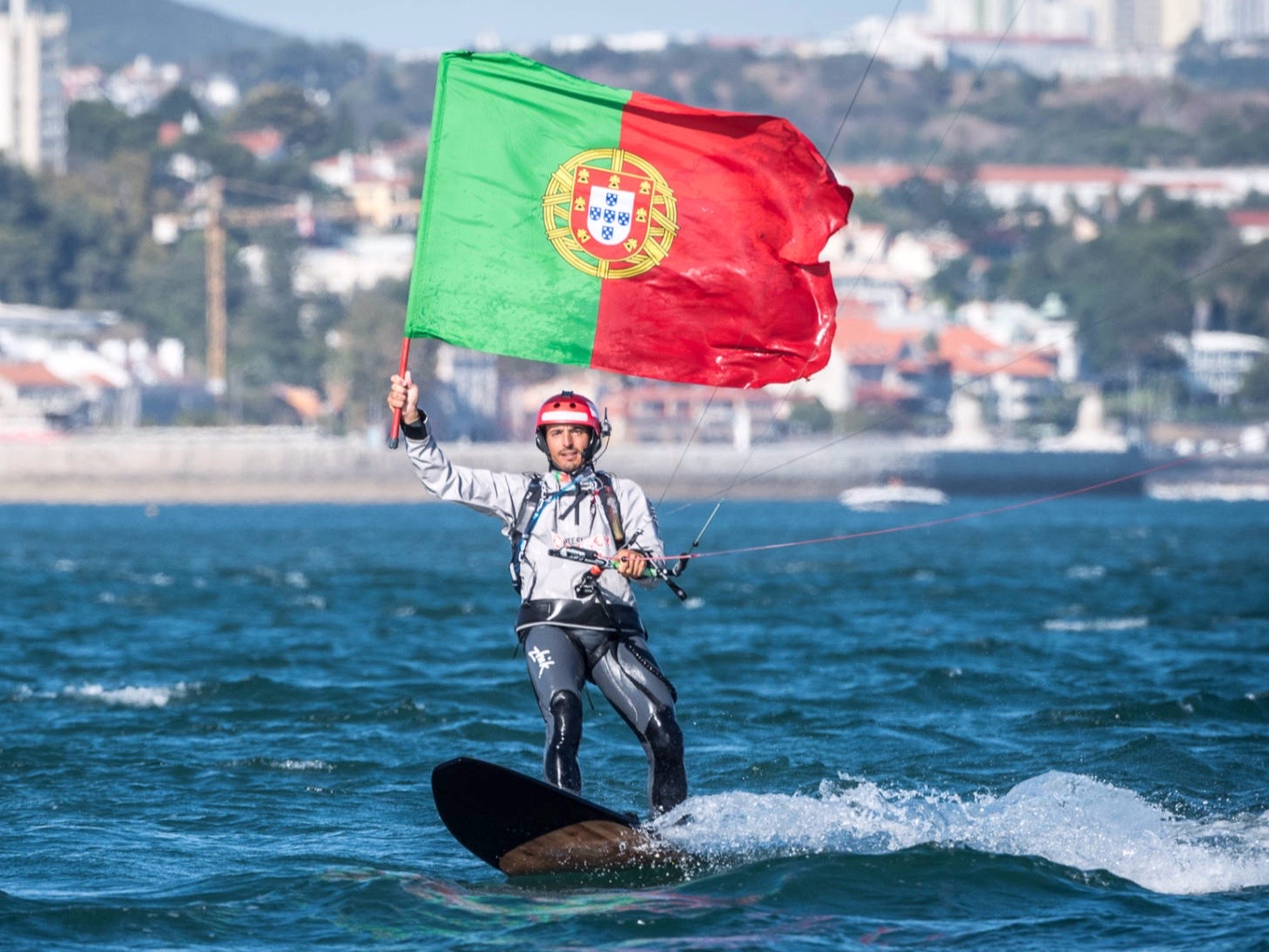 Francisco Lufinha kitesurfing Portuguese flag